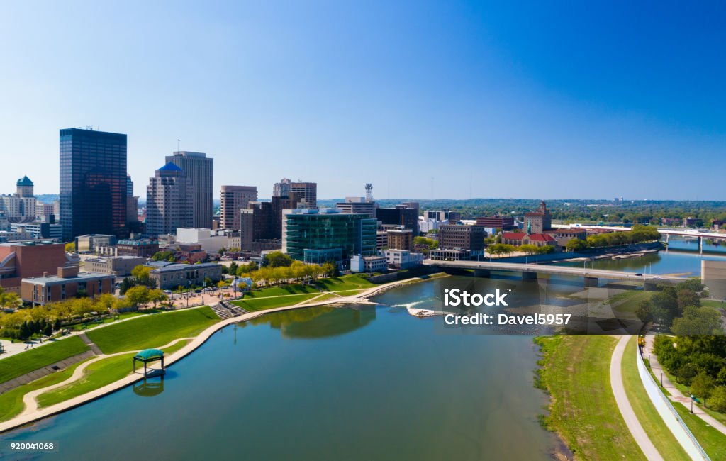 Dayton Aerial With River And Bridge Downtown Dayton skyline aerial view with a bridge on the right, and with the Great Miami River in the foreground. Dayton - Ohio Stock Photo