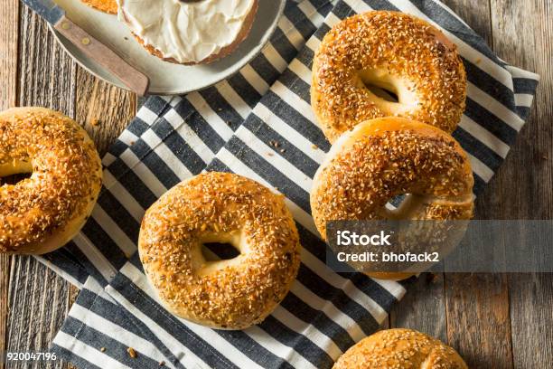 Round Warm Everything Bagels Stock Photo - Download Image Now - Bagel, Onion, Baked