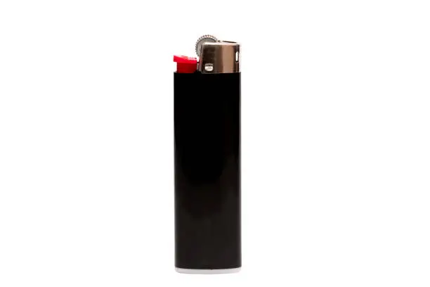 Photo of Black lighter isolated on white background, with clipping path. Design element.