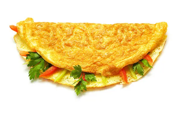 Omelet with herbs and tomatoes isolated on white