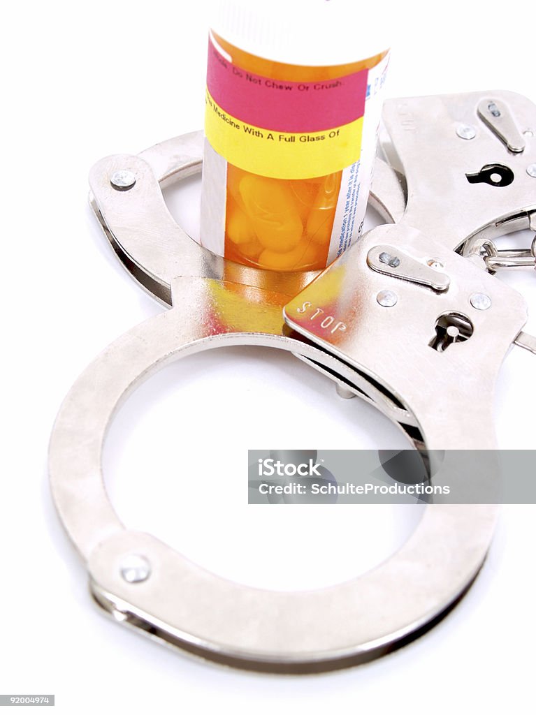 Handcuffed per prescrizioni - Foto stock royalty-free di Accudire