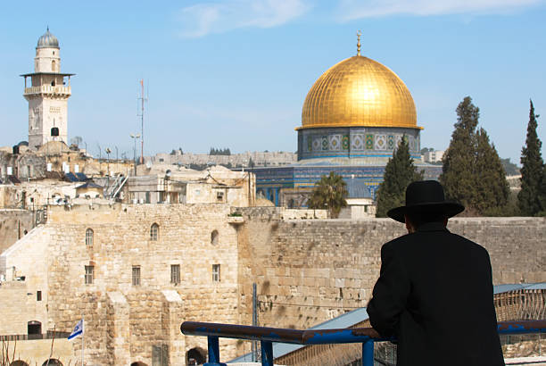 istock Silhouette of a man looking over to the mosque 92005299