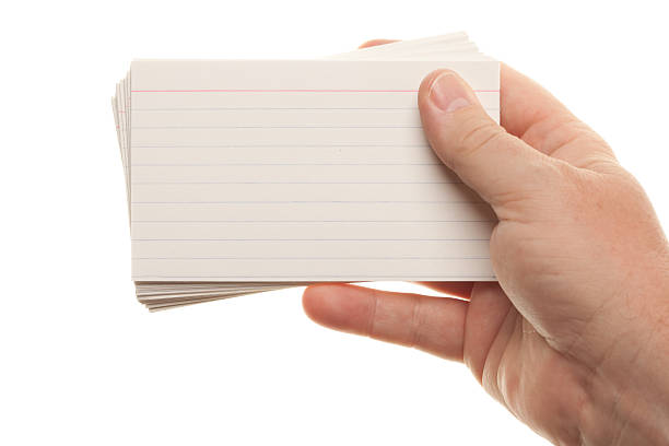 Male Hand Holding Stack of Flash Cards stock photo