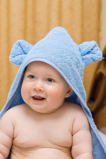istock Small smiling baby in blue towel 92005956