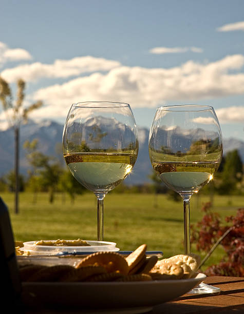Snowy Mountains Seen Through Wine Glasses  downunder stock pictures, royalty-free photos & images