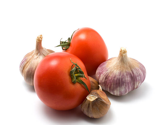 istock tomato and garlic isolated on white 92007830