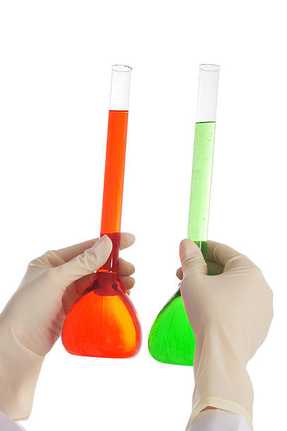 istock Hand holding red and green tubes isolated on white 92010065