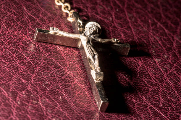 istock Silver Crucifix and Holy Bible 920103602