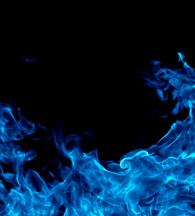 Blue fire isolated on black background.