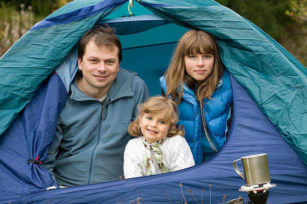 istock Happy family camping in tent 92010842