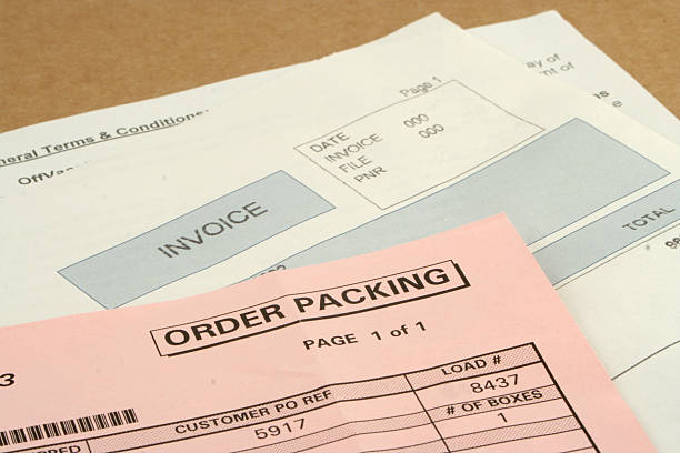 istock Close up, partial view, of three packing slips or invoices  92011145