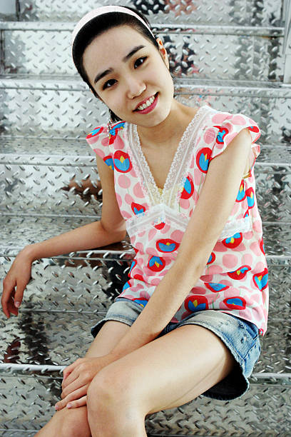 istock Korean woman on silver stairs 92012058
