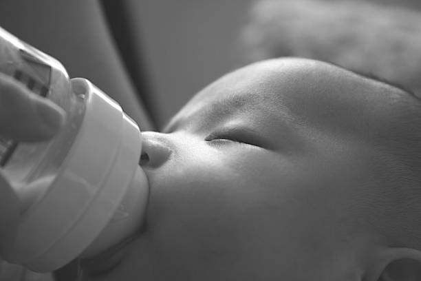 istock Baby boy enjoying milk 92012082
