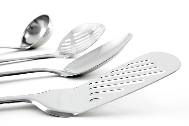 Close-up of stainless kitchen utensils stock photo