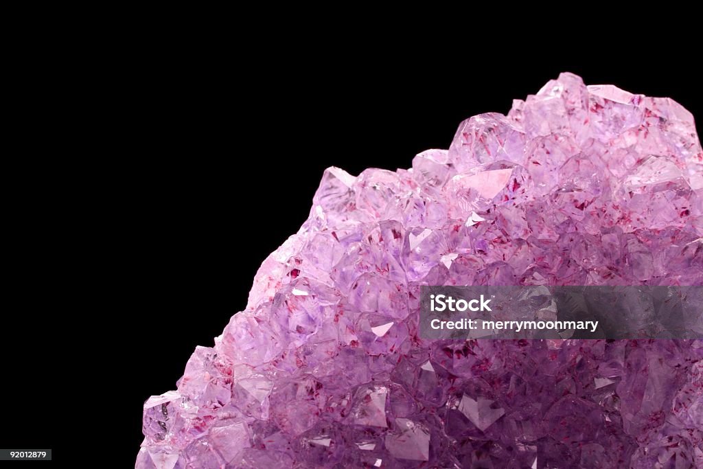 pruple crytsal a cluster of natural purple amethyst crystals with copyspace for a new age background Alternative Medicine Stock Photo