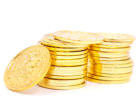 Gold coins stacked isolated on white