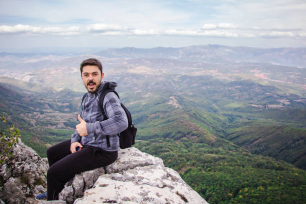 istock Young man on top of the mountain. 920136162