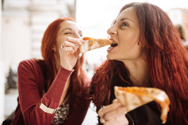 istock friends eating pizza togetherness in italy 920140730