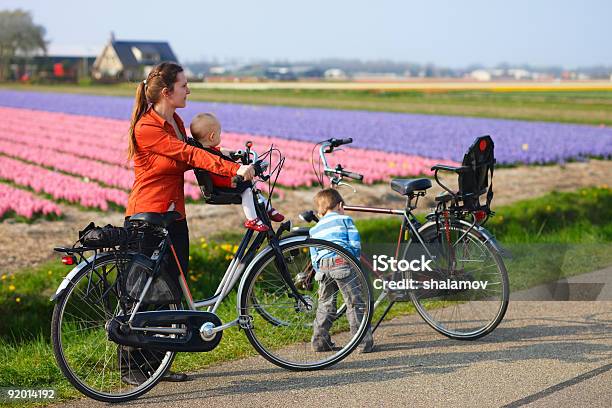 Bicycling In Tulip Fields Stock Photo - Download Image Now - Netherlands, Family, Agricultural Field