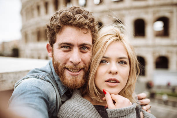 istock tourist in Rome take a selfie at coliseum 920142806