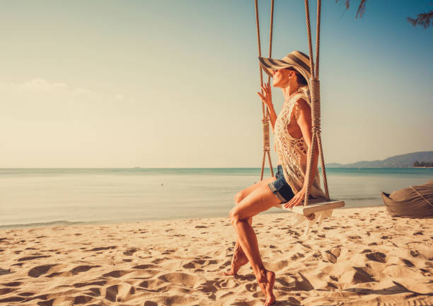 istock Woman at tropical swing 920143076