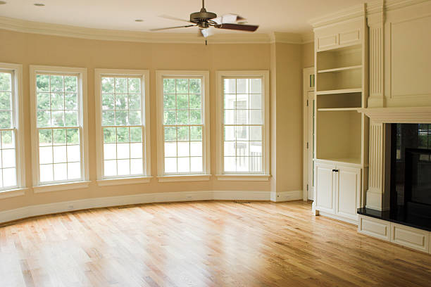 Large empty room with parquet floors with oval windows