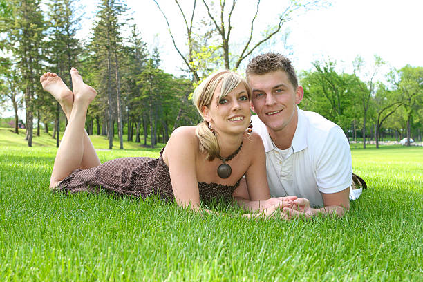 Close up of beautiful couple sitting in the nature, selective focus