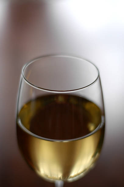 Glass and wine on a white background stock photo