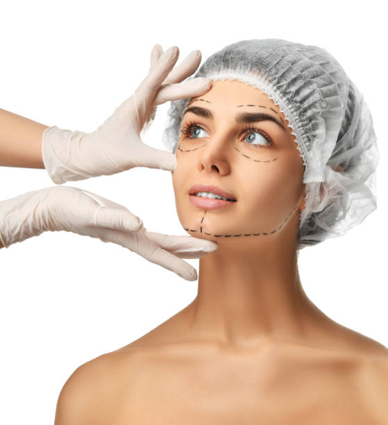 istock Plastic surgery concept perforation lines on face girl with blue eyes 920151528