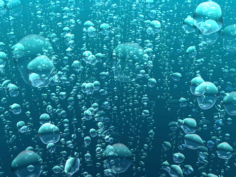 Dreamy sparkling bubbles in light underwater scene.