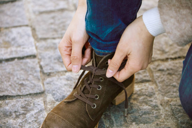istock tying the shoelaces, no face 920161190