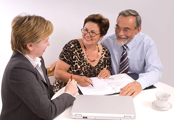 istock A couple receiving advice from a financial planner 92016216