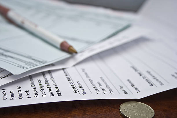 Financial concept - Earnings statement and pay check stock photo