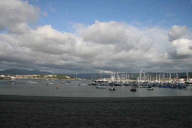 Beach and ships in Galicia stock photo