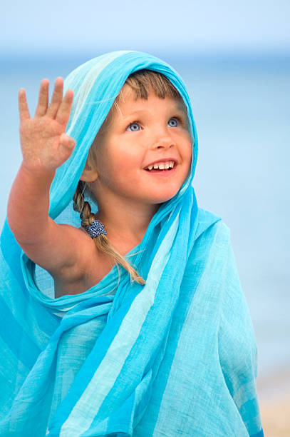 Child in blue pareo stock photo
