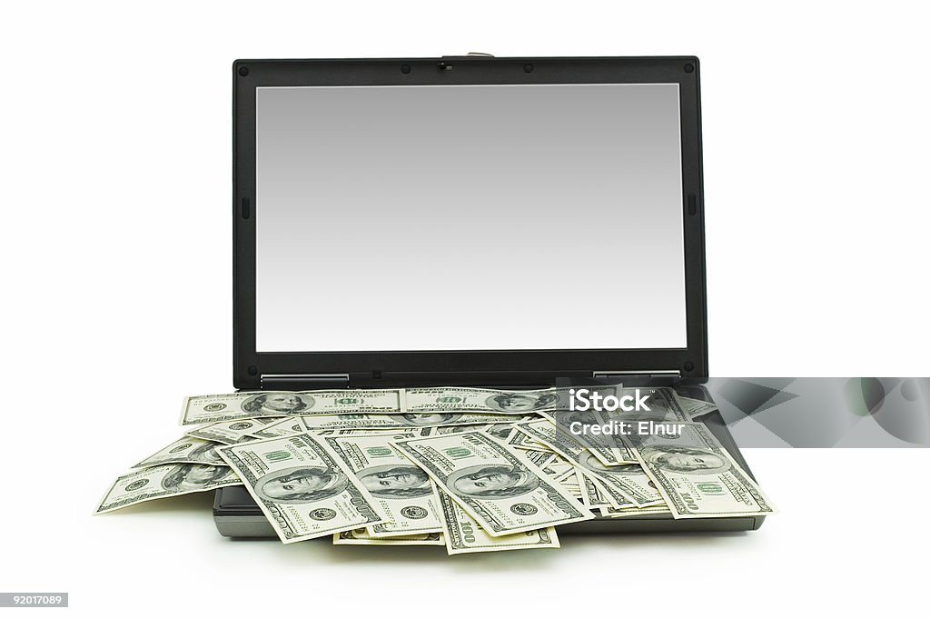 E-commerce concept avec dollars et un ordinateur portable isolé sur le blanc - Photo de Activité bancaire libre de droits