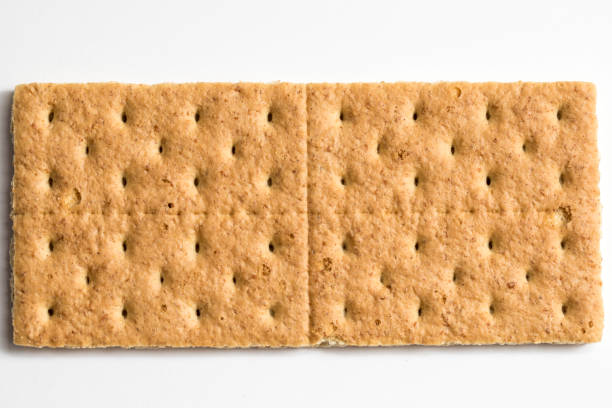 Graham Cracker Graham cracker photo shot close up with a macro lens and a white background cracker stock pictures, royalty-free photos & images