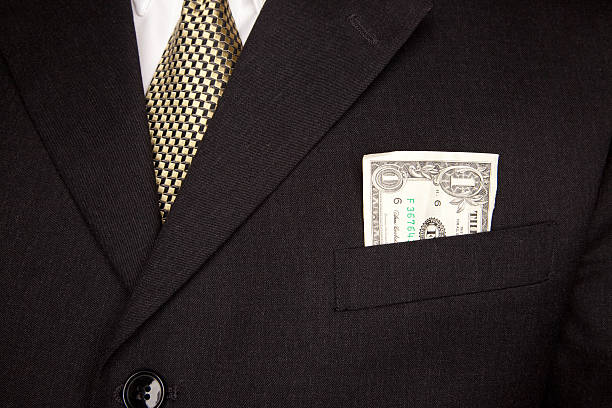 istock U.S. Dollar Bill in Businessman's Coat Pocket 92017568
