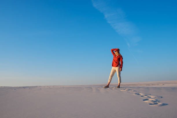 istock Dreaming young woman, blonde posing in the desert 920176548