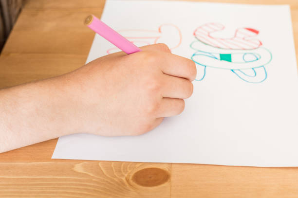 istock Girl hand writing 