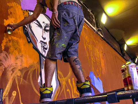 Sao Paulo, Brazil, Janeiro 27, 2007. Man makes a graffiti in the wall on Paulista Avenue tunnel, for the celebrations of Japanese Immigration to Brazil