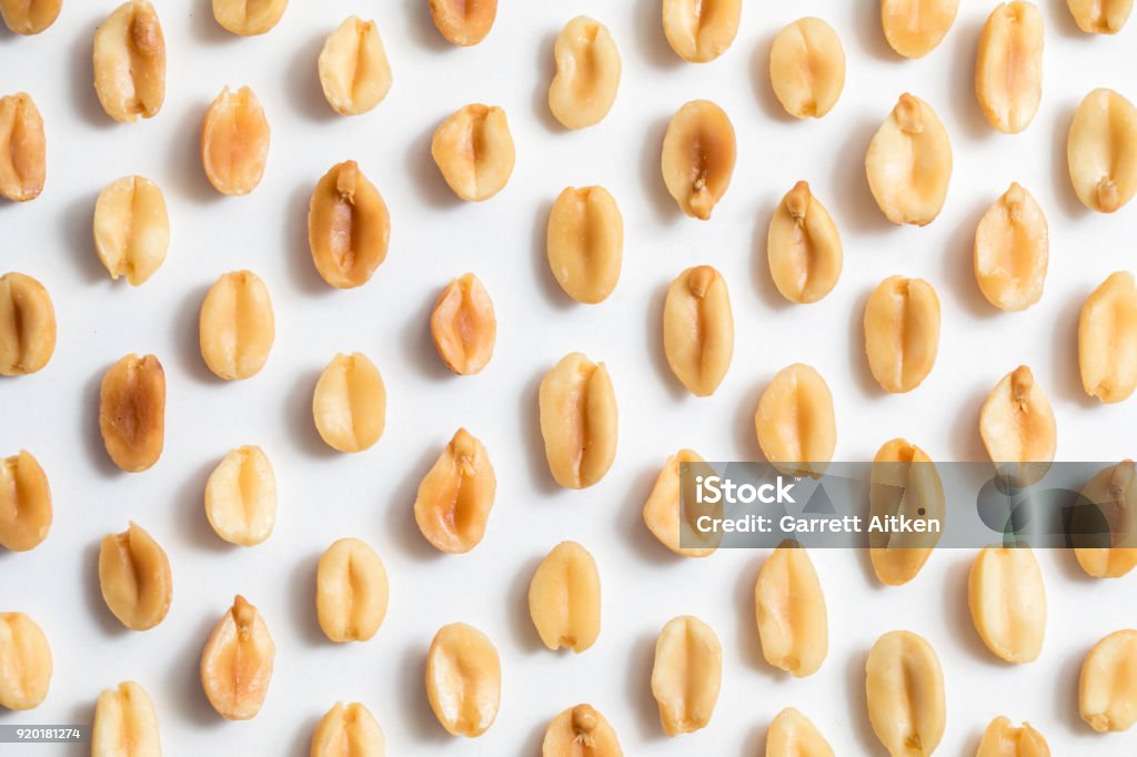 Peanuts Peanuts shot close up against a white background Peanut - Food Stock Photo