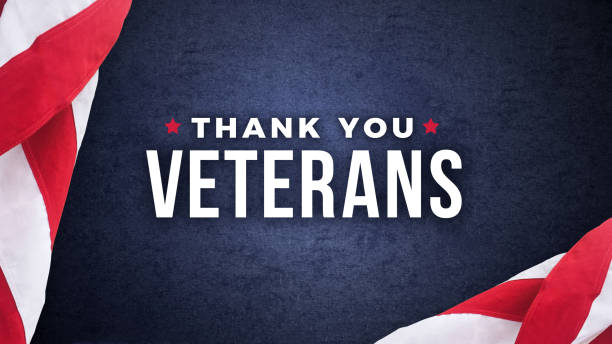 istock Thank You Veterans Text with American Flags Over Dark Blue Background 920193802