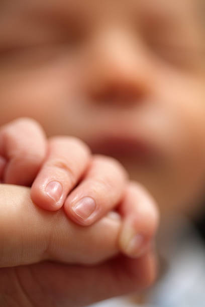 istock Newborn baby grasps his mothers hand 92019723