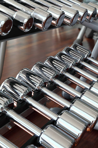 istock Dumbbells in fitness center 92020082