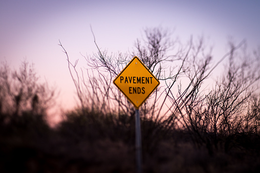 pavement ends street sign selective focus tilt shift