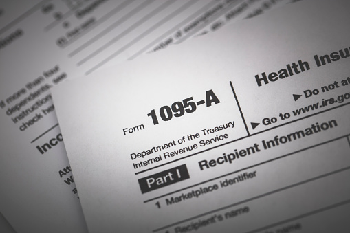 A stock photo of IRS Form 1095-A used for reporting health insurance coverage on the IRS income tax report.
