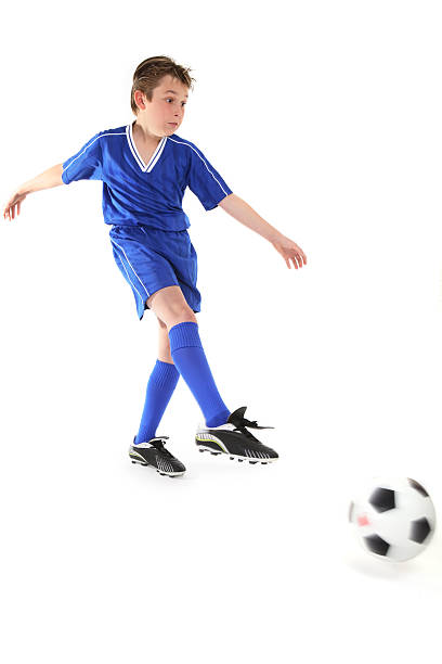 istock Kicking a soccer ball 92022574