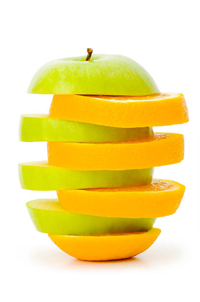 istock Sliced orange and apple isolated on the white 92023020