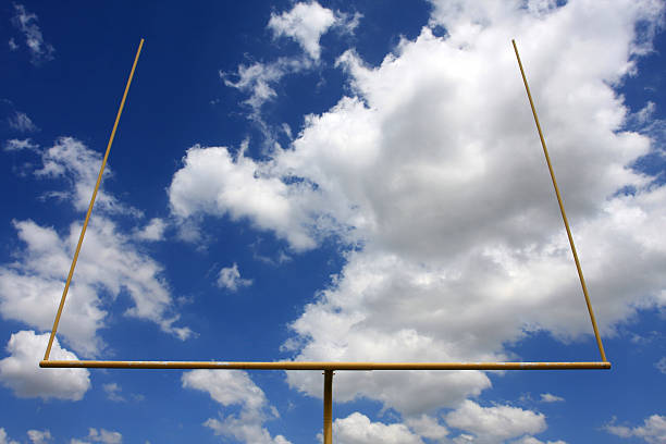 istock American Football Goal Posts Amongst a Cloudy Sky 92023381